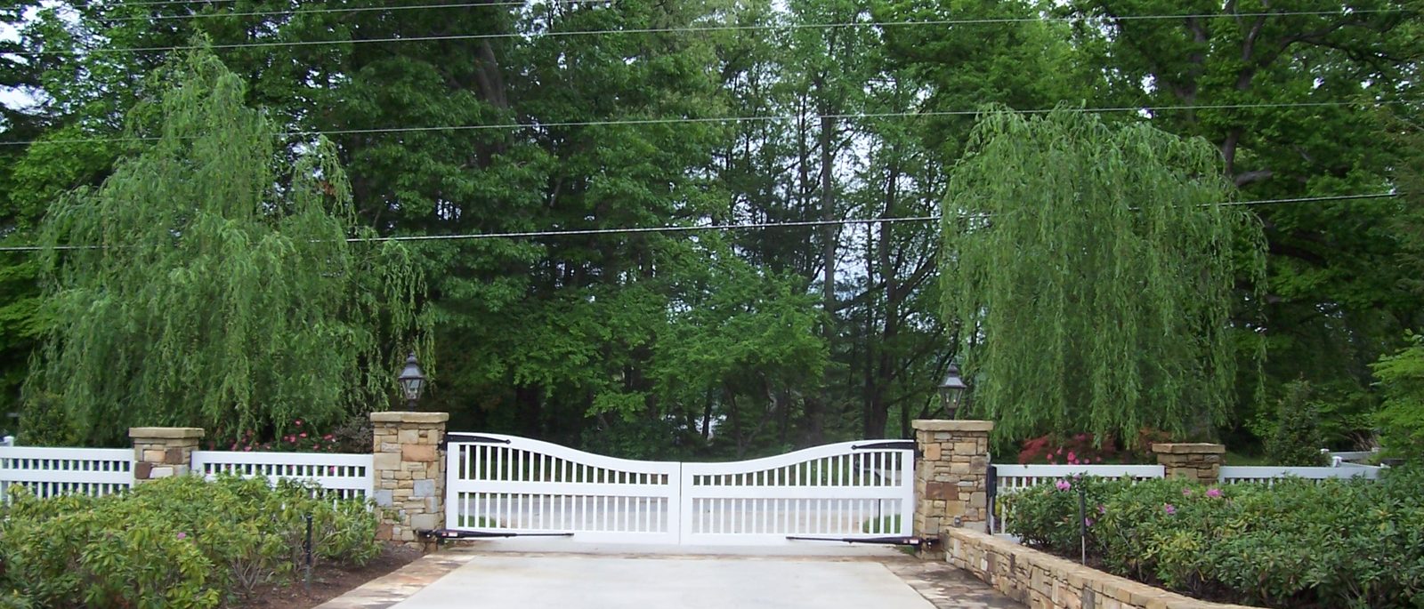 The willow-lined gated entrance to the Silver Ridge estate