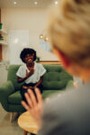 woman sitting in therapy