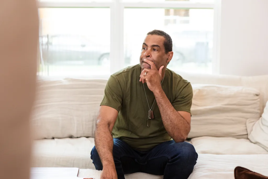 Sitting alone in his living room, the retired mature adult soldier deals with difficult memories.