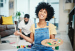 Woman treating herself to a painting class after celebrating a sober milestone