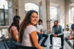 Young woman smiling while in the middle of recovering from addiction